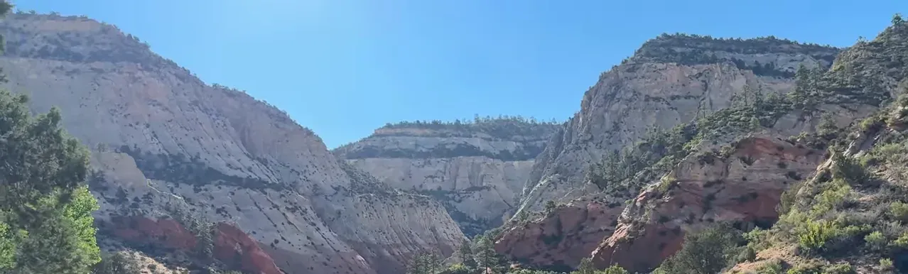 Narrow walls of Red Hollow Canyon showing smooth Navajo sandstone