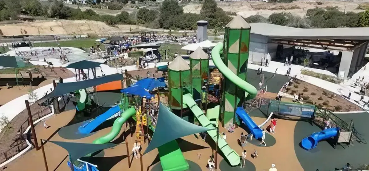Aerial view of Lehi Family Park playground with slides and shaded play areas, labeled 'Lehi Family Park'
