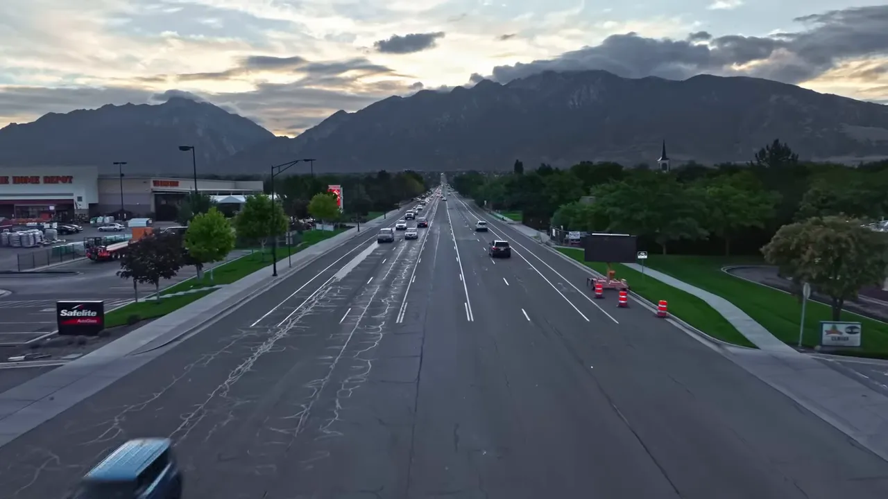 Home backyard bordering a busy surface street